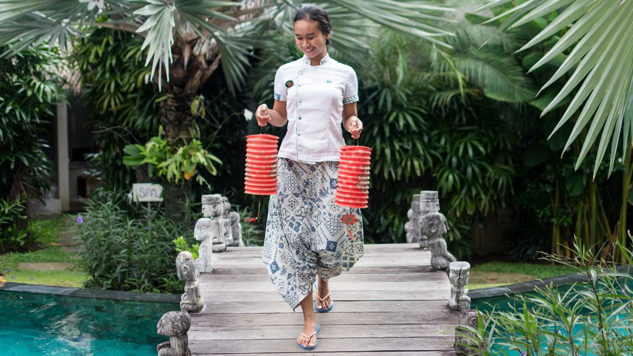 A hotel team mate prepares lanterns for Chinese New Year celebrations in Bali